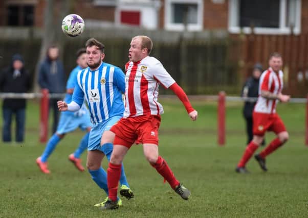 Ryhope CW (red/white) take on Crook Town last season. Picture by Kevin Brady