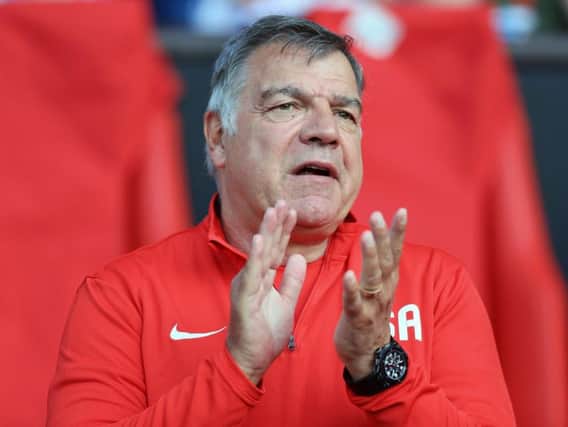 Sam Allardyce encourages his England team on from the stands in last night's Soccer Aid charity game at Old Trafford.