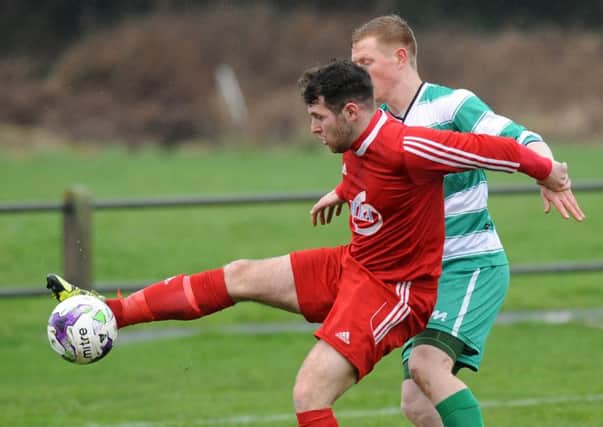 Striker Chris Winn (red) has joined Bishop Auckland from Washington