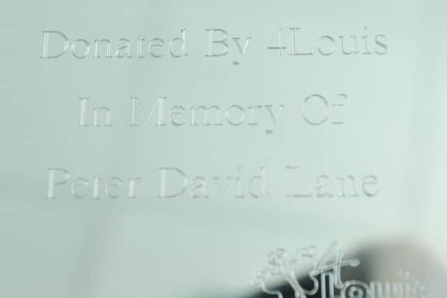 The name plaque that was placed on the donated Cuddle Blanket. Photograph by FRANK REID