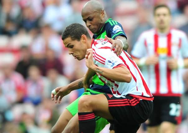 Sunderland target Andre Ayew takes on Black Cats midfielder Jack Rodwell last season. Picture by Frank Reid