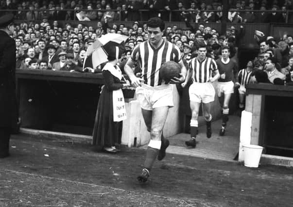 Date: 02/11/2006   Photographer: SE    
BLACK AND WHITE IMAGE OF CHARLIE HURLEY LEADING TEAM FOR CUPTIE AGAINST EVERTON - FEBRUARY 1964 OLD REF SPORT 2 174 picture caption: Charlie Hurley dedicated to the task of leading Sunderland back to the First Divsion, takes out his team for their day of Cup glory at ROKER Park on Saturday, when they proved how well they are equipped for a promotion by handing out a hiding to First Divsion champions, Everton Sunderland Echo Monday February 17 1964