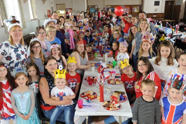 Brownies and Rainbows from 19th Sunderland St Gabriel's unit celebrate the Queen's 90th birthday with an indoor street party.