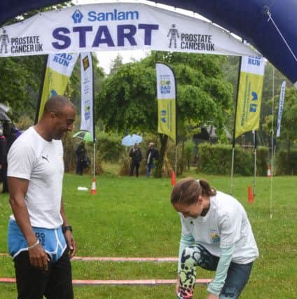 Olympian Colin Jackson watches Sunderland runner Alyson Dixon igets into her Y Fronts at the start of the Go-Dad race at Silksworth Sports Complex on Sunday, which was to raise awareness to prostrate cancer