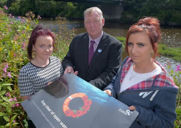 Dated: 25/08/2015 River Safety... Beth McCabe (blue jacket) and Shauna Nichol who have worked with Sunderland Council and the RNLI to produce a water safety campaign in memory of their friends Tonibeth Purvis and Chloe Fowler who both tragically drowned in the river Wear at Fatfield in 2013. With Cllr John Kelly Portfolio Holder for Public Health, Wellness and Culture. #NorthNewsAndPictures/2daymedia