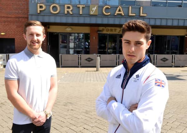 Olympic hopeful boxer Josh Kelly (right) with sponsor Port of Call. Manager Adam Dickman (L)
