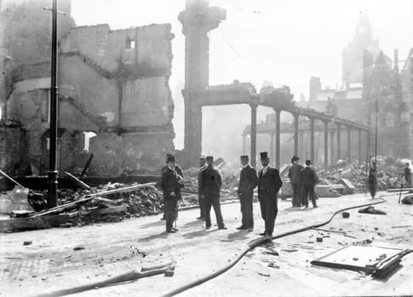 The men of the time survey the scene of the disaster.