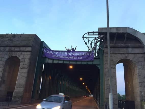The dads have scaled Queen Alexandra Bridge, in Sunderland.