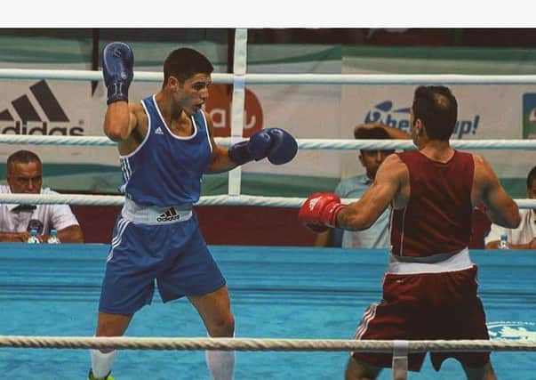 Josh Kelly (left) in charge against Amin Ghasemi Pour in Baku