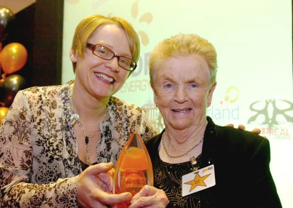 Louise Murray of EDF Energy (left) present the Fundraiser of the Year Award to Eleanor Sparks.