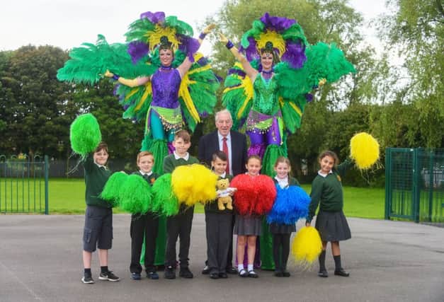 Chairman of the West Area Committee Coun. Peter Gibson and pupils from Broadway Primary School, setting out on the Road to Rio