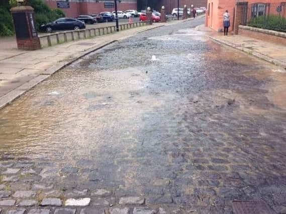 Water running in Low Street. Picture from Northumbrian Water.