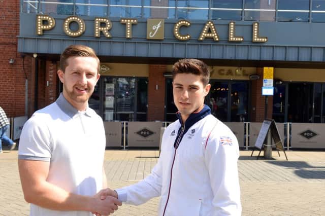 Olympic hopeful boxer Josh Kelly with sponsor Port of Call's manager Adam Dickman (L)