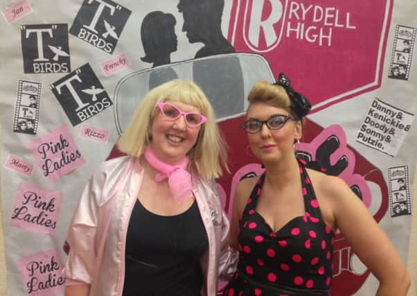 Staff at the Grease-themed event for cancer charity.