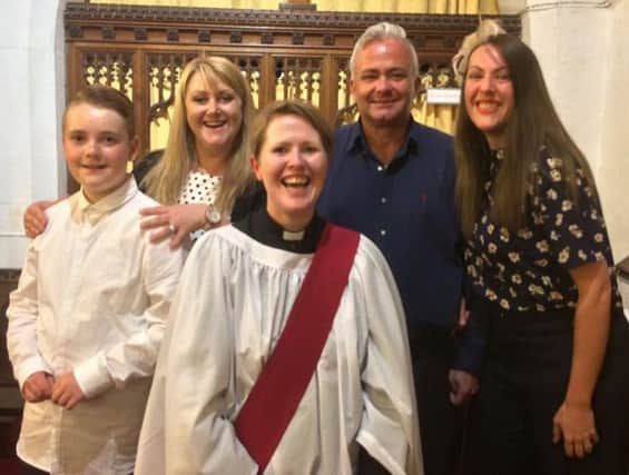 The Reverend Kate Jamie, from St Mary's Church, with church members at the confirmation.