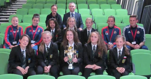 St Bede's Catholic Comprehensive School under-13 girls with their tournament trophy.