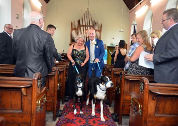 Clare and Mel Dixon renew their wedding vows with dog's Nettie and Oscar