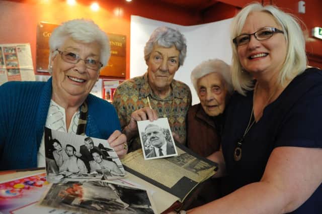 Thompson Park Community Centre chairman Jan Pringle. right, joins founder members Marion Lewis, Moira Dixon and Margaret Dagg, to look at some memorabillia celebrating the centre's 60th anniversary.