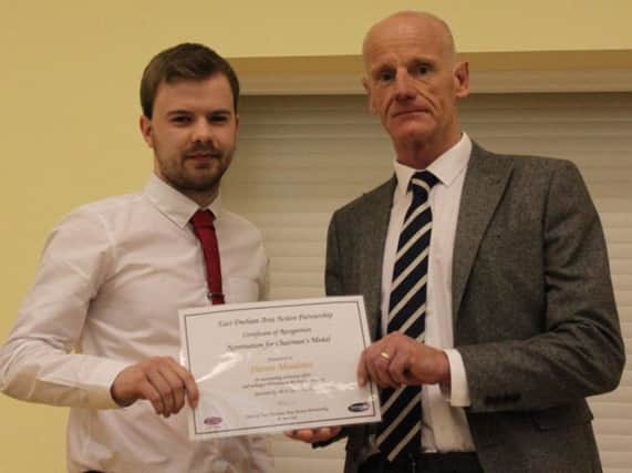 East Durham Area Action Partnership Chairman Malcolm Fallow presents certificates in recognition of their voluntary work within their local communities.  Pictured Darren Meadows.