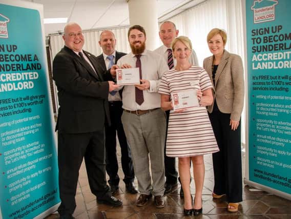 Councillor Graeme Miller, presents Philip Shaw and Denise Ridley with their awards from NESHA North East Student Housing Awards with Paul Allison, Kevin Shaw, and Sunderland City Council Principal Housing Officer, Liz McEvoy.