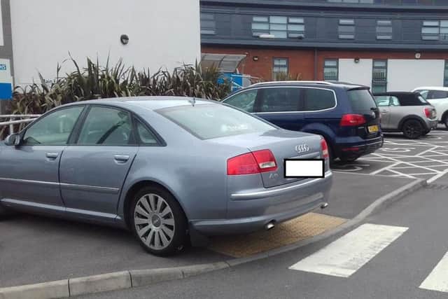 Audi car parked over part of a ramped area for wheelchairs users at Riverview Health Centre, in Hendon, on Tuesday, June 28.