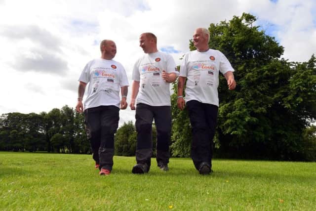 Charity walkers raise funds for 4Louis charity. From left Paul Taft, Phil Barker and Mark Deleon.