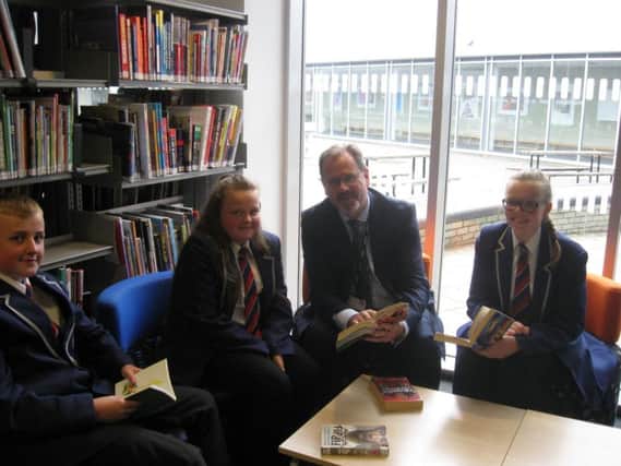John McGuinness, the Executive Principal of Academy 360 in Pennywell, with pupils.