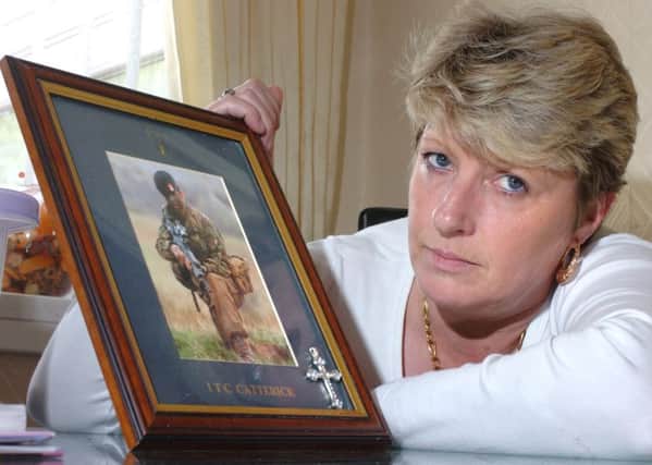 Janice Procter with a picture of her son Private Michael Tench who was killed in Iraq in January 2007.