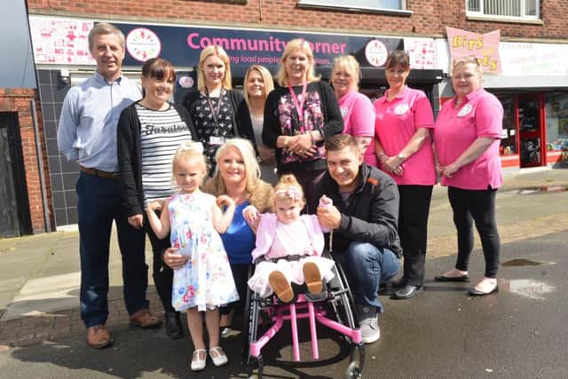 Spina bifida sufferer two year old Rubie O'Brien  receive new special wheelchair with help from Community Corner. Front mother Ciara Heffernan, father Kent O'Brien and sister Lillie O'Brien aged 5