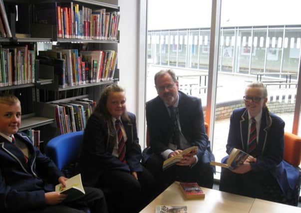 John McGuinness, the Executive Principal of Academy 360 in Pennywell, with pupils.