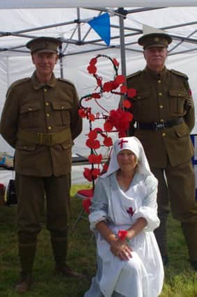 Nurse Margaret with First World War soldiers at the reminiscence fair held at the Donnison School.