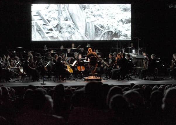 Royal Northern Sinfonia, Field Music and Warm Digits perform the score to Asunder live at the Sunderland Empire Theatre.