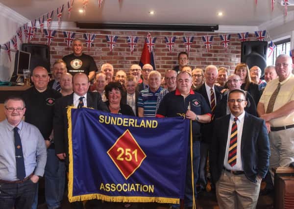 Members of the Sunderland 251 Association with their new standard after it was dedicated at The Gunners Club, Mary Street, Sunderland, on Sunday.