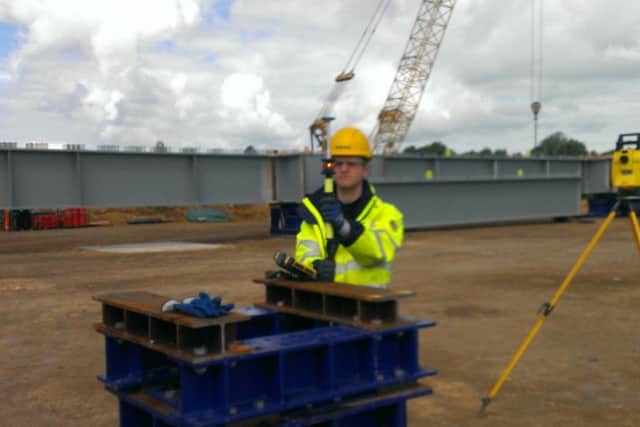 Chris Glover works on site
