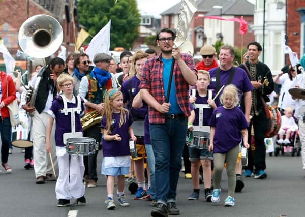 FESTIVAL: Artistic Director Ross Millard leads the Summer Streets Music Festival parade towards Thompson Park Picture: DAVID WOOD