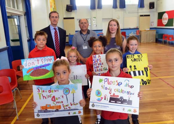 Back, headteacher Philip Adamson, school crossing patrol officer Ron Newland and parent Michelle Edwards. Front, poster makers April Patterson-Brown, Amber Tate, Martin Swirles, Danielle Sutherland, Cele Nelson and Tamsin Maughan.