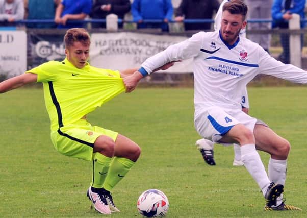 Jake Orrell (left) in action at Billingham Town. Picture by Tom Collins.