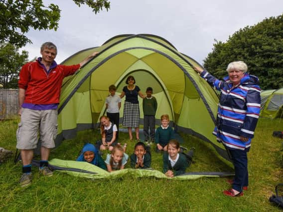 Headteacher at Hudson Road Primary School, Cathy Westgate, with pupils in one of the tents used to learn more about the great outdoors, with Anthony Reynolds of Reynolds Outdoor Centre and Councillor Ellen Ball.