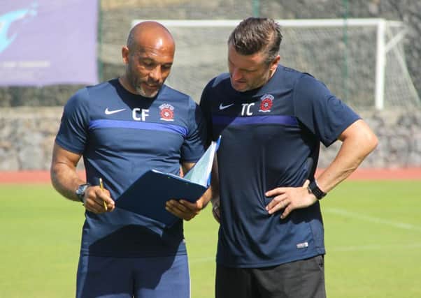 Hartlepool Uniteds Curtis Fleming and Tony Caig are on deep conversation during pre-season training in Tenerife.