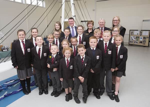 Pupils at Northern Saints Primary School are pictured with the large model of Sunderlands New Wear Crossing. Pictured (back, from left) are Headteacher Steve Williamson, Brigid McGuigan, Cllr Harry Trueman and Christine Williams.