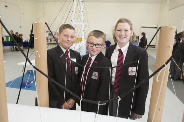 Pupils Kyle Turner, Joe Middleton and Charlie West, all Year 6, showcase their class entry.