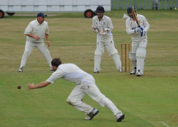 Littletown batsman Matt Dench watches as Murton bowler Sam Sanderson goes close to catching him out. Picture by Tim Richardson