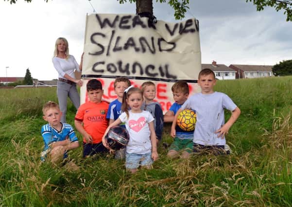 Plumtree Avenue residents and children are angry over grass not being cut by council. Bernadine Anderson