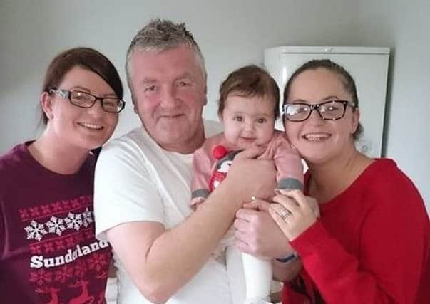 Stewart Anderson, pictured holding his granddaughter Neve Allcroft, with daughters Kelly Beston, left and Kay Allcroft.