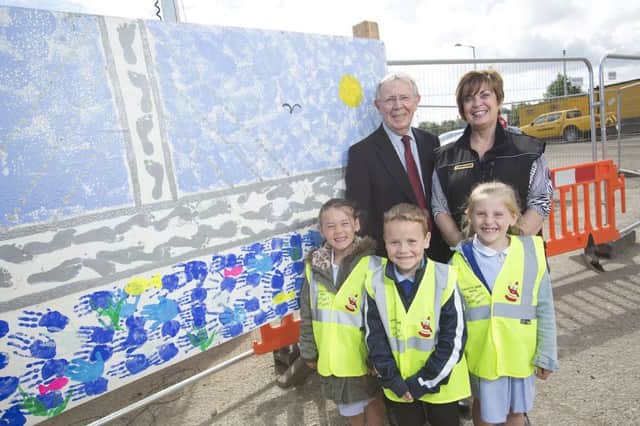 Pupils in reception used their hands and feet to paint bridges. Pictured are Sunderland City Councils deputy leader, Coun Harry Trueman, FVBs community engagement manager Brigid McGuigan, and pupils Isabella Wells, 6, Jonathan Gamble, 6, and Olivia Terrell, 7.