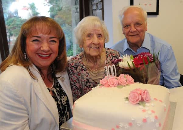 100 year old Wyn Davison celebrates her birthday, with nephew Ron Clark and Sharon Hodgson MP.