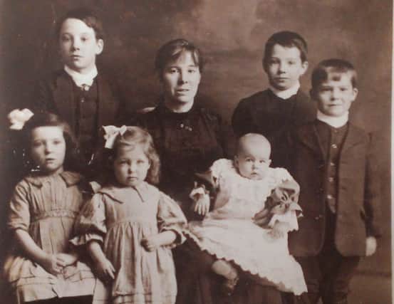 A family photo showing Jessie Peverley and her children.
Back row - Edward, left; Tommy; and Walter, far right.
Front row - Anne, left, daughter Jessie, mum (also Jessie) centre, and baby Rose Marie.