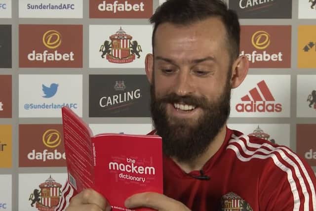 Former SAFC player Steven Fletcher reading from the first edition of the Mackem Dictionary