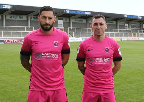 Billy Paynter (left) and Nathan Thomas model the new Hartlepool United away kit, sponsored by Northern Gas and Power