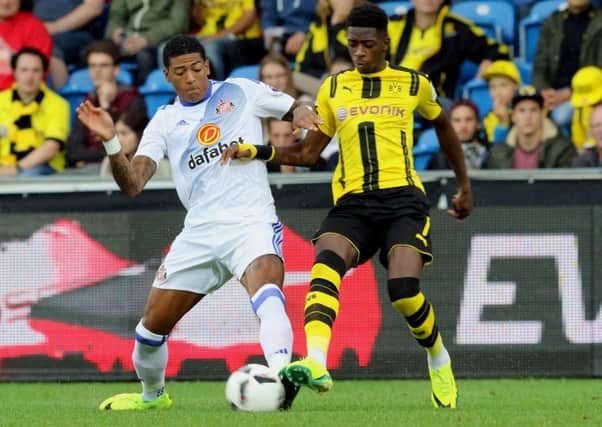 Patrick van Aanholt takes on Dortmund's Ousmane Dembele last night